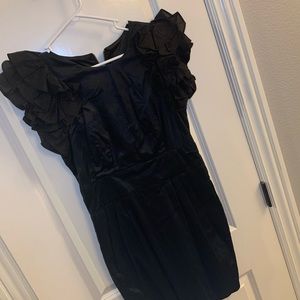 Black cocktail dress with pockets.